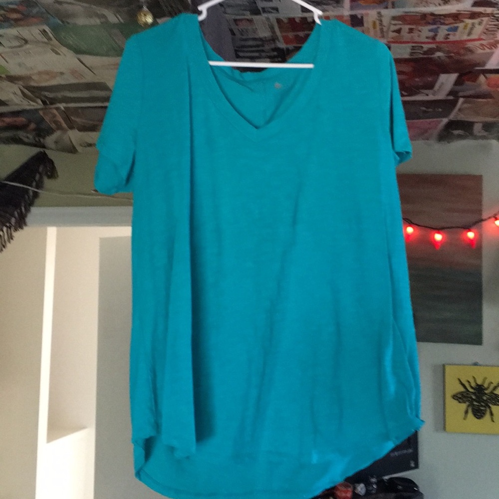 teal v-neck t shirt. navy poncho